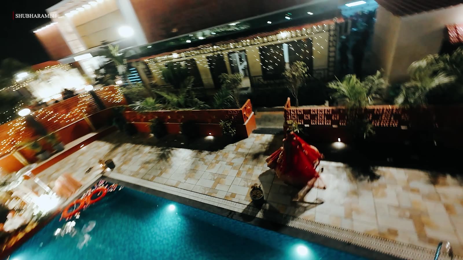 Aerial night frame of an estate pool wedding venue
