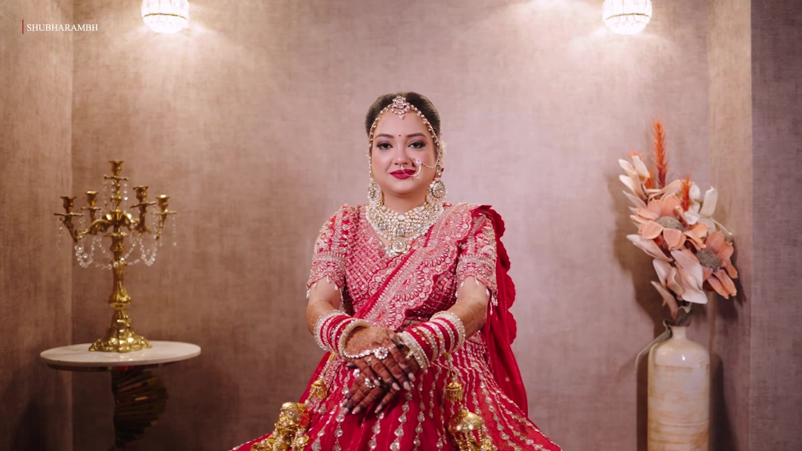 A quiet bridal portrait beside a golden candelabra