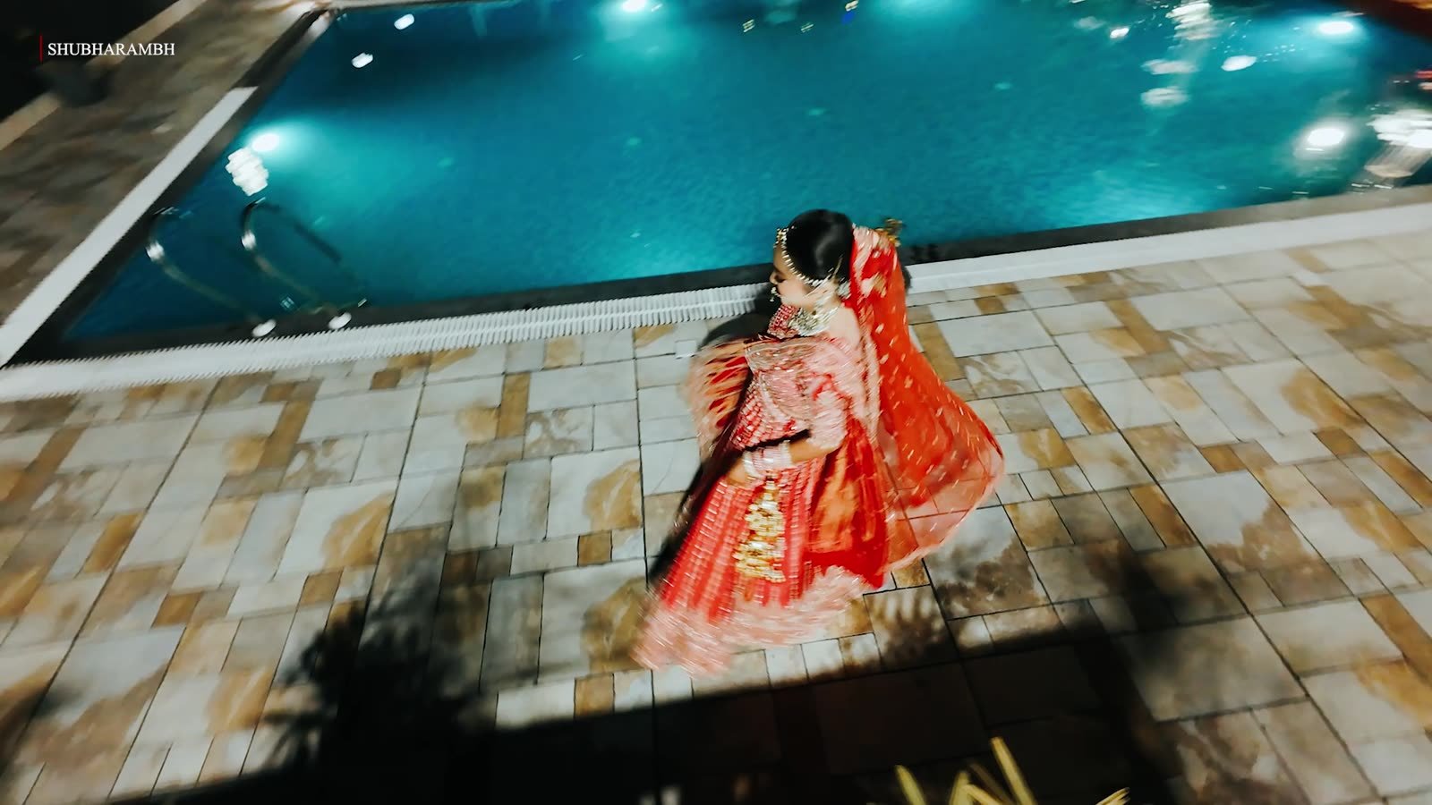 Overhead frame of a bridal twirl in red
